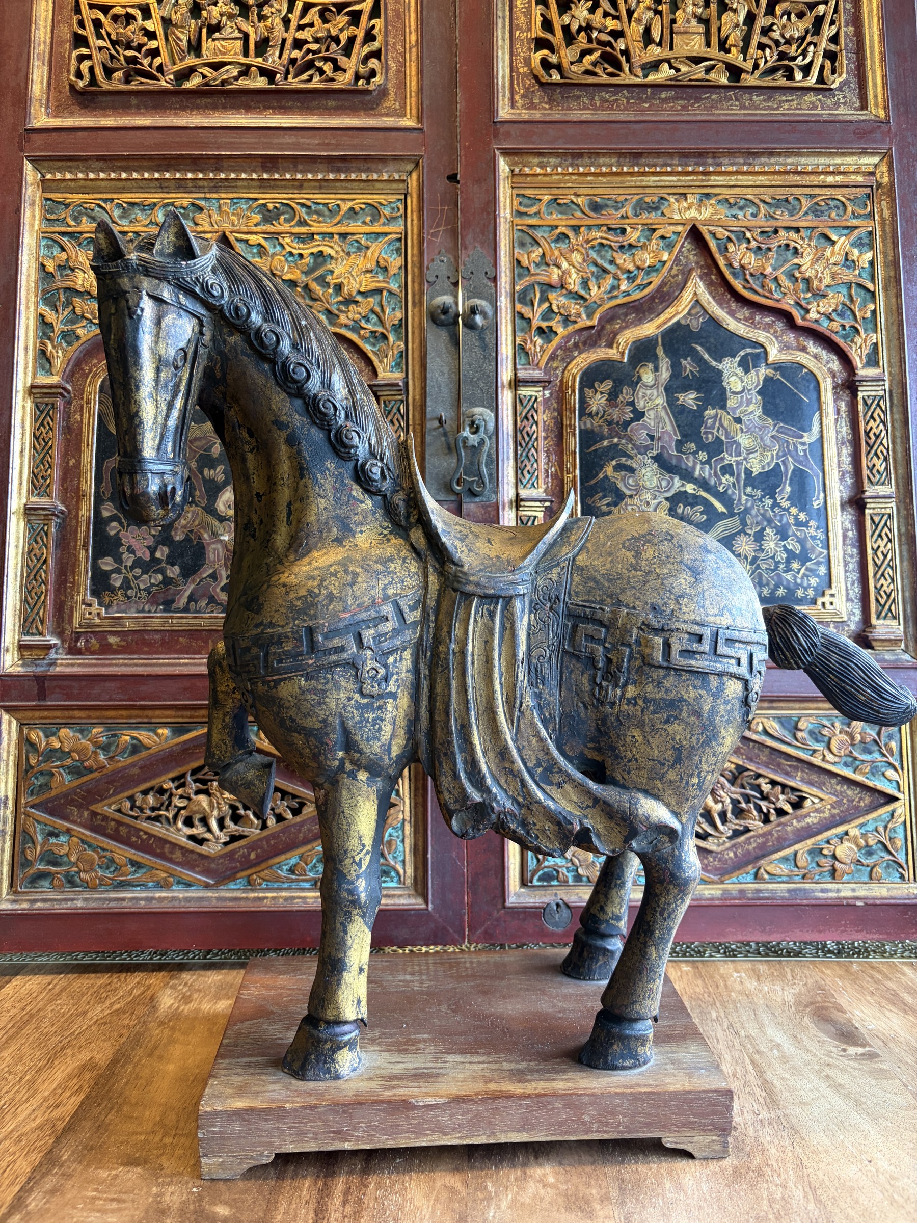 Gilt Lacquered Tang-Style Horse with Raised Foreleg