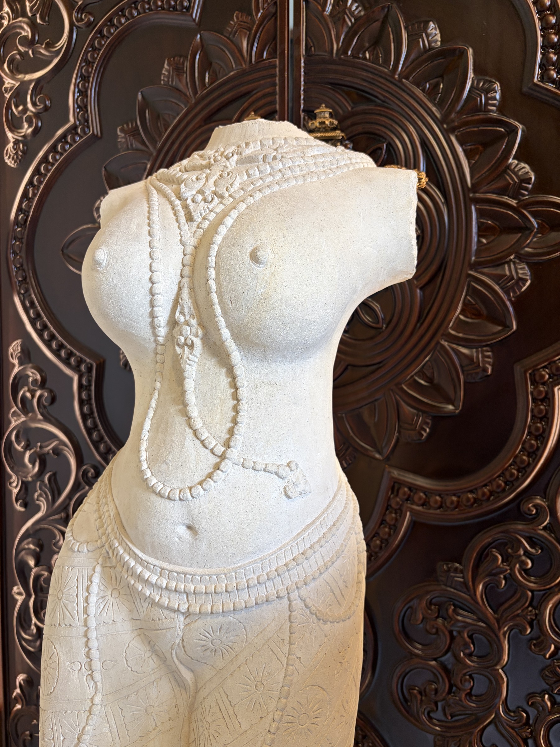 Carved Stone Torso of a Woman in a Sarong view 2